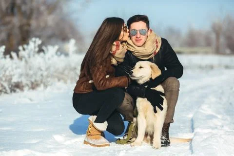 Young couple having fun in winter park 스톡 사진