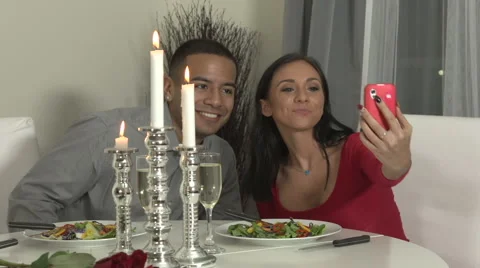 Young couple having romantic dinner at home, taking selfie Stock Footage 44113793