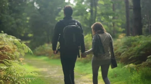Young couple Hiking in the forest  Stock-Footage 55564491
