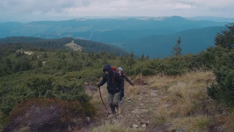 Young couple hiking in mountains Video stock 82723385