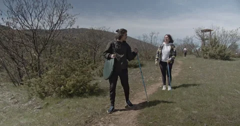 Young Couple Hiking in Nature, Exploring Scenic Trails and Enjoying the Outdoors Stock Footage 312003329