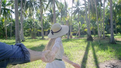 Young couple holding hands blond tourist woman leading boyfriend, running into p Stock Footage 201096503