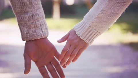 Young couple holding hands Stock Footage 73429146