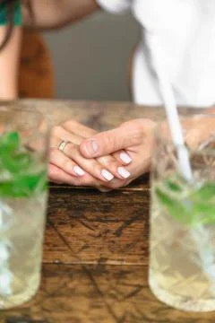 Young couple holding hands with the wedding rings Stock Photos