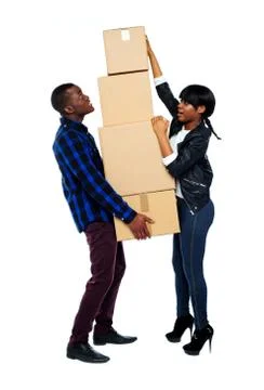 A young couple holds boxes in studio Stock Photos