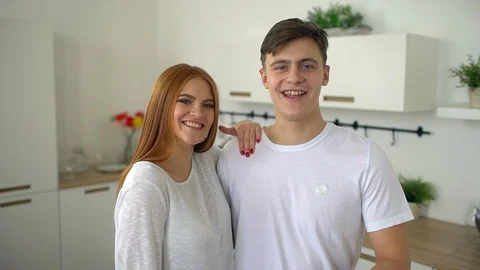 Young couple in home kitchen talking to camera. slow-motion Stock Footage 86195062
