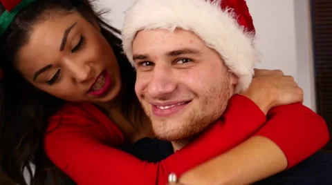 Young couple hugging and smiling. Christmas time. 50 fps. Stock Footage 57369488