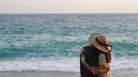 Young couple hugging on beach during romantic walk Stock Footage 154772042