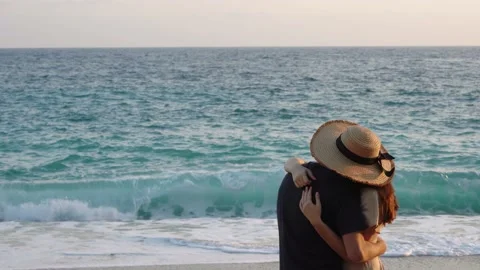 Young couple hugging on beach during romantic walk Stock Footage 158187784