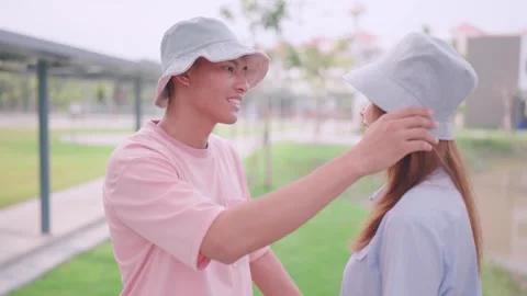 Young couple hugging each other standing outside the station Talk during the day Stock Footage 265142467
