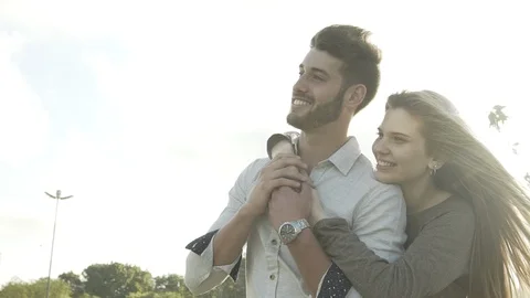 Young couple hugging in park Stock Footage 106316619