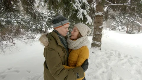 Young couple hugging in winter park Video stock 102339810