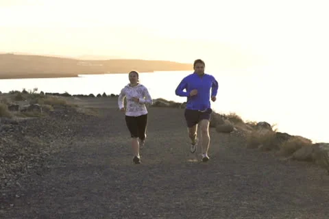 Young couple jogging on the beach, slow motion shot at 240fps Video stock 22944655