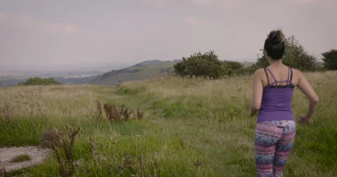 Young couple jogging in field Stock-Footage 59899975