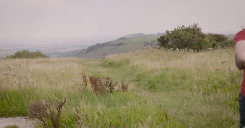 Young couple jogging in field Stock Footage 59899979