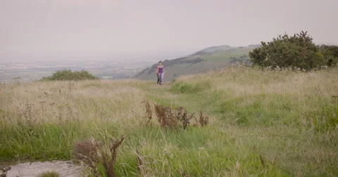 Young couple jogging in field Stock-Footage 59899984