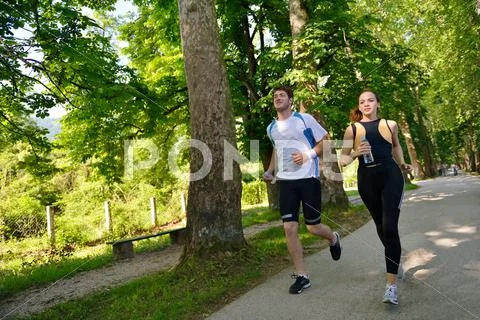 Young couple jogging Stock Photos