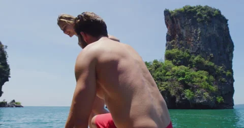 Young couple jumping off long tail boat to go swimming, Long tail boat tourist i Stock Footage 201095883
