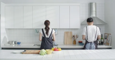 The young couple in the kitchen Stock Footage 100947592