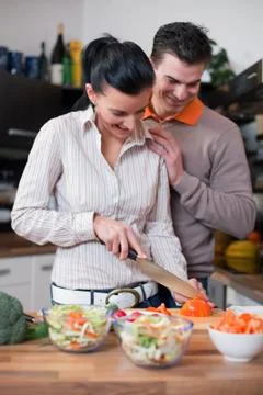Young couple in kitchen Stock Photos