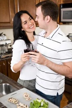 Young couple in the kitchen Stock Photos