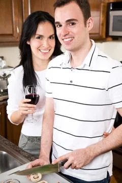Young couple in the kitchen Stock Photos
