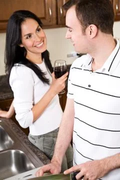 Young couple in the kitchen Stock Photos