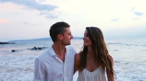 Young Couple Laughing on Beach Stock Footage 52551689