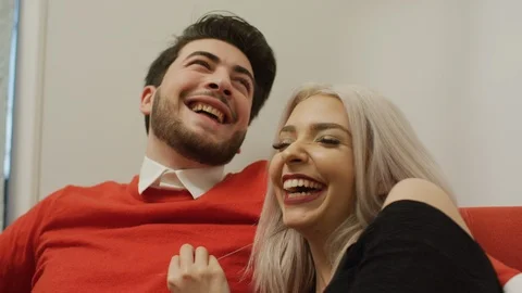 Young couple laughing Stock Footage 99940880