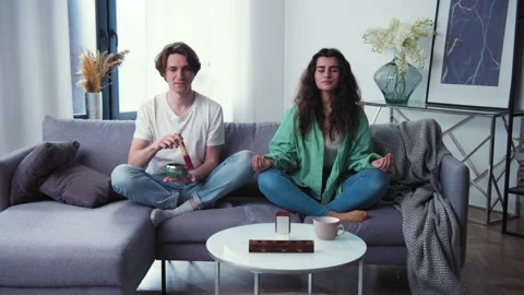 Young couple learning to care mental health. Family try meditation with tibetan Stock Footage 153615522