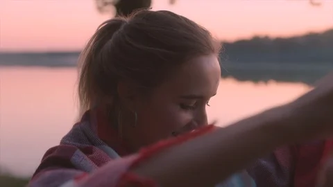 Young couple is lighting sky lantern at sunset Video stock 98919269