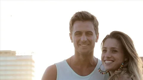 Young couple looking at camera and smiling. 스톡 동영상 88438204