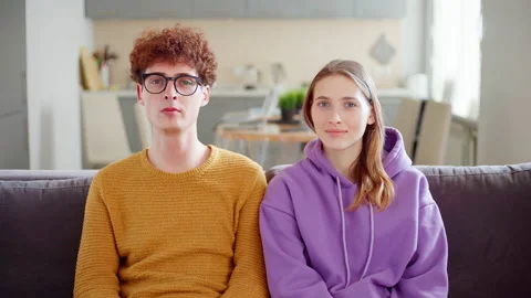 Young couple looking at camera and at each other Stock Footage 155531051