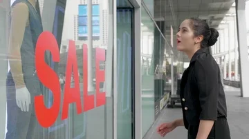 Young Couple is Looking at the clothes window shop Stock Footage 85868260
