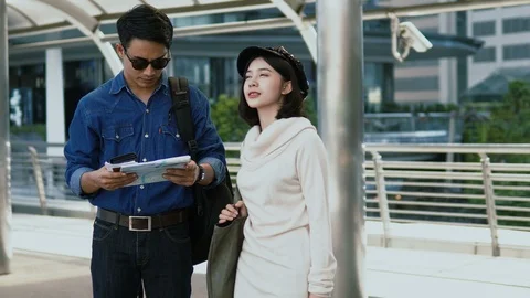 The young couple looking for a destination before walked out Stock Footage 85594942
