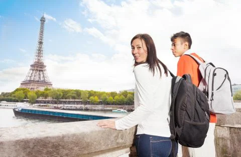 Young couple looking at the Eiffel Tower in Paris Stock Photos