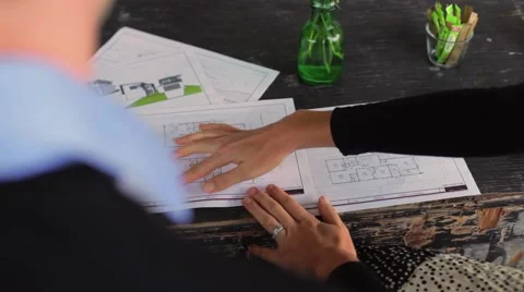 Young couple looking at house drawings2 Stock Footage 47888375