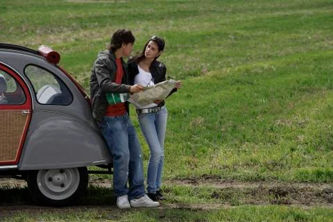 Young couple looking at map Stock Photos