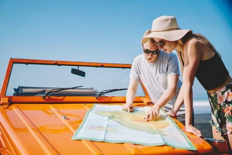 Young couple looking at map Stock Photos