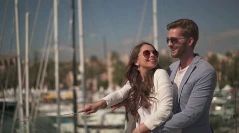 Young couple looking at marina Stock Footage 62707873