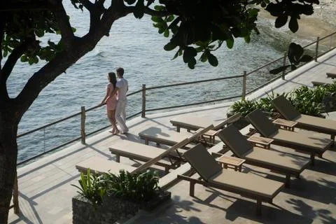 Young couple looking at ocean view Stock Photos