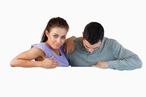 Young couple looking over a wall Fotos Stock
