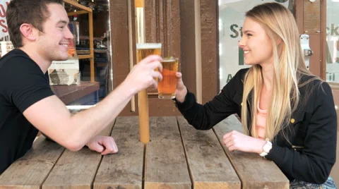 Young couple in love at cafe drinking and toasting beer 4k 스톡 동영상 49391786