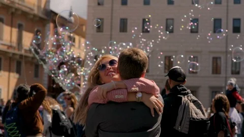 Young couple in love is having fun in the city centerof Rome in front of old Video stock 123291065