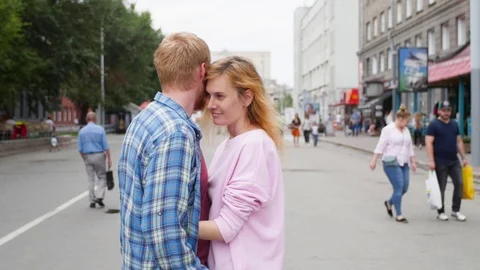 Young couple in love, hugging on the street. Selective focus. woman and man Vídeos de archivo 106964604