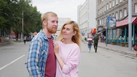Young couple in love, hugging on the street. Selective focus. woman and man Video stock 106964652
