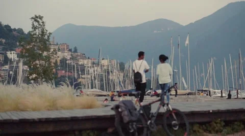 A young couple in love is walking down the shore Stock Footage 66487092