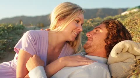 Young Couple Lying on Beach Sand Dunes Stock Footage 21833079
