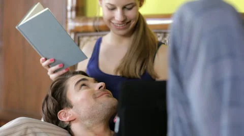 Young couple lying on bed Stock Footage 996658