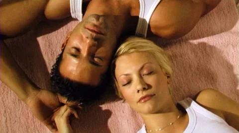 Young couple lying on floor Stock Footage 43699451